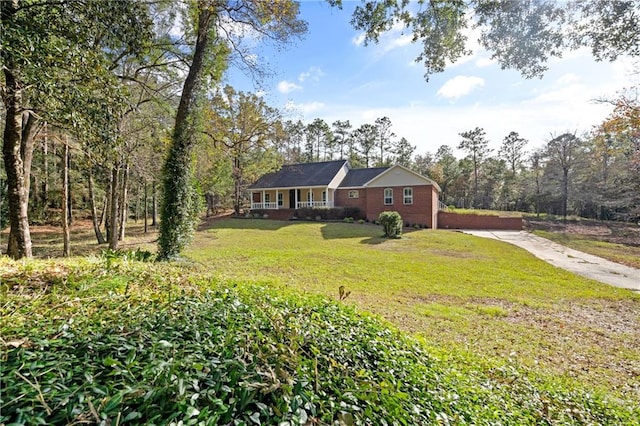 ranch-style home with a front lawn