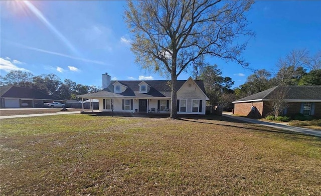 view of front of home with a porch and a front yard