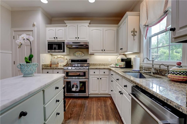 kitchen featuring crown molding, stainless steel appliances, dark hardwood / wood-style flooring, sink, and white cabinets