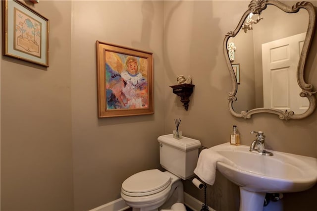 bathroom with sink and toilet