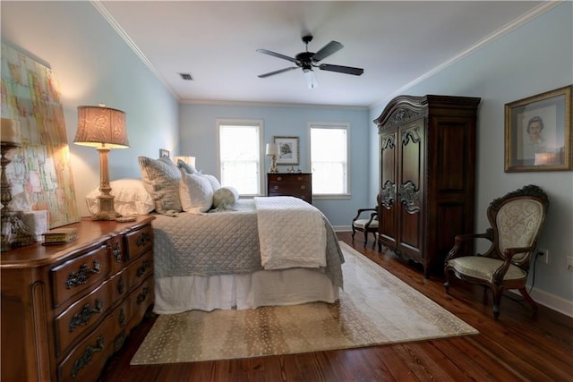 bedroom featuring crown molding, dark wood-type flooring, and ceiling fan