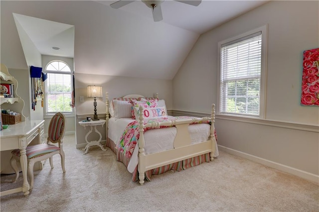 bedroom with ceiling fan, carpet floors, and vaulted ceiling