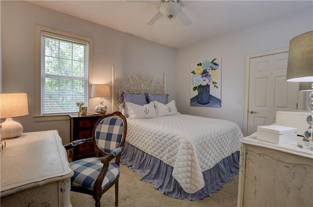 carpeted bedroom featuring ceiling fan