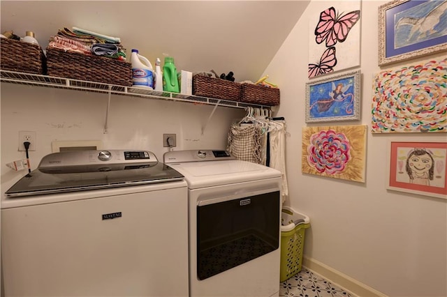 washroom featuring hookup for an electric dryer, hookup for a washing machine, washer and clothes dryer, and light tile floors