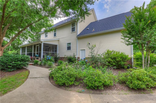 rear view of house with a sunroom