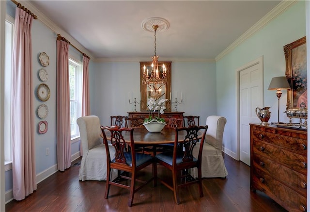 dining area featuring dark hardwood / wood-style floors, ornamental molding, and a chandelier