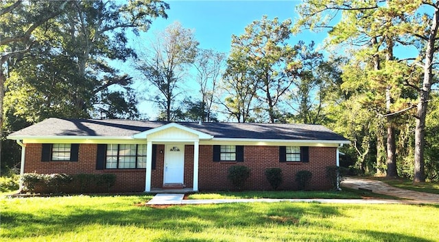 ranch-style home with a front yard