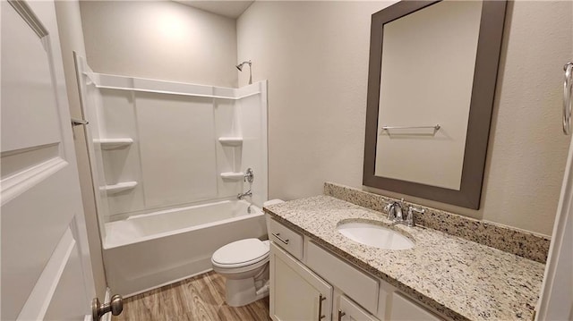 full bathroom with toilet, vanity, shower / bath combination, and hardwood / wood-style flooring