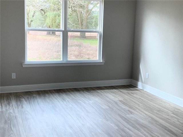 empty room with hardwood / wood-style floors