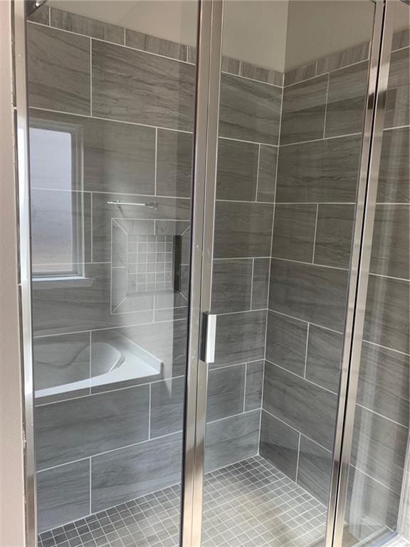 bathroom with shower with separate bathtub