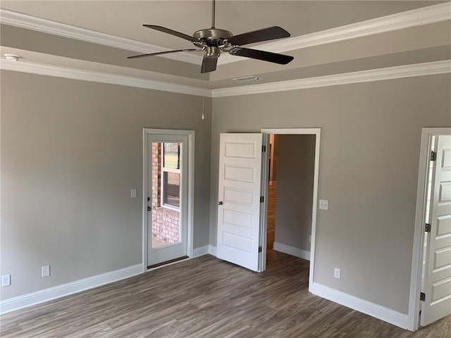 interior space with dark hardwood / wood-style floors, ceiling fan, and ornamental molding