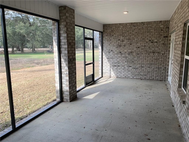 unfurnished sunroom featuring plenty of natural light