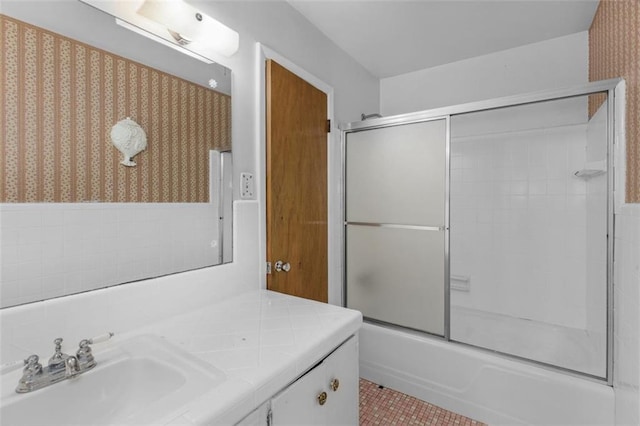 full bathroom featuring tile patterned flooring, combined bath / shower with glass door, and vanity