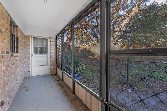 unfurnished sunroom with plenty of natural light