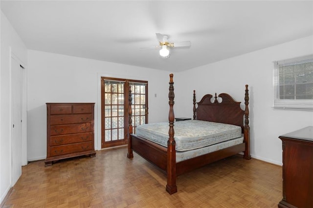 bedroom featuring french doors, ceiling fan, and baseboards