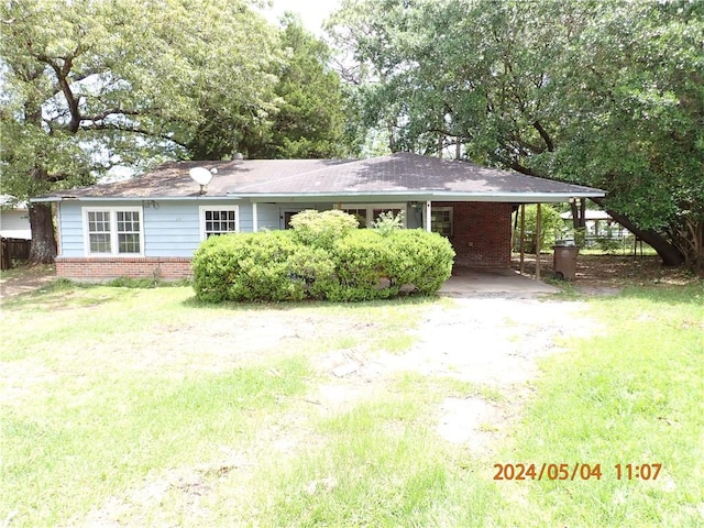 single story home featuring a carport