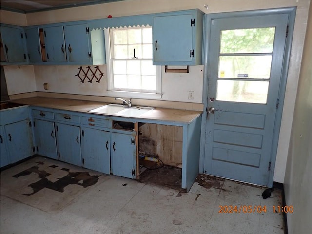 kitchen with sink and blue cabinets