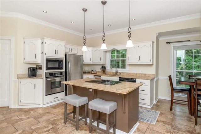 1509 Ridgeland Rd E, Mobile, AL 36695 - kitchen featuring black appliances, white cabinets, a center island, pendant lighting, and light stone counters