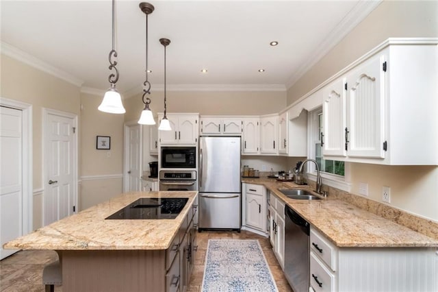 1509 Ridgeland Rd E, Mobile, AL 36695 - kitchen featuring black appliances, a center island, white cabinets, ornamental molding, and light stone counters