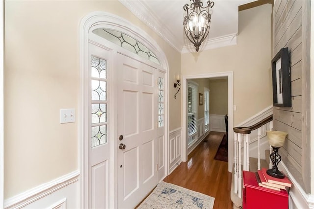 1509 Ridgeland Rd E, Mobile, AL 36695 - entryway featuring ornamental molding, wood finished floors, a chandelier, a wainscoted wall, and a decorative wall