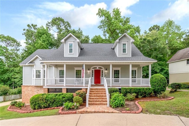 1509 Ridgeland Rd E, Mobile, AL 36695 - new england style home with a porch and a shingled roof
