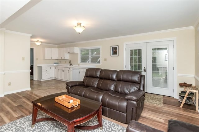 1509 Ridgeland Rd E, Mobile, AL 36695 - living room with ornamental molding, light wood-style floors, and french doors