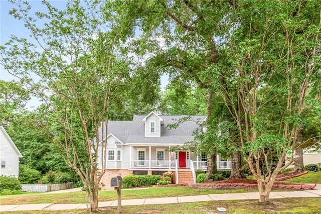 1509 Ridgeland Rd E, Mobile, AL 36695 - new england style home with a porch and a front yard