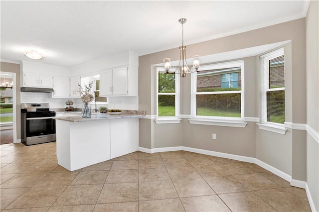 1115 Newbury Ln W, Mobile, AL 36695 - kitchen with gas range, a chandelier, a peninsula, light countertops, and backsplash