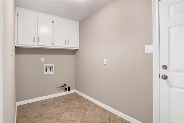 1115 Newbury Ln W, Mobile, AL 36695 - washroom featuring hookup for a washing machine, gas dryer hookup, cabinet space, a textured ceiling, and light tile patterned flooring