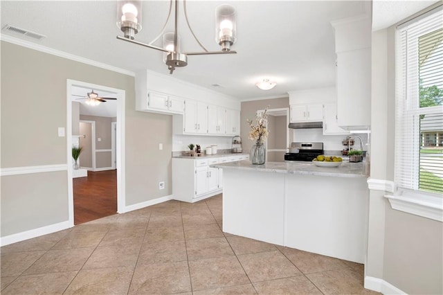 1115 Newbury Ln W, Mobile, AL 36695 - kitchen with stainless steel gas range oven, light countertops, a peninsula, white cabinets, and under cabinet range hood