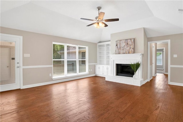 1115 Newbury Ln W, Mobile, AL 36695 - unfurnished living room featuring vaulted ceiling, ceiling fan, wood finished floors, built in shelves, and a fireplace