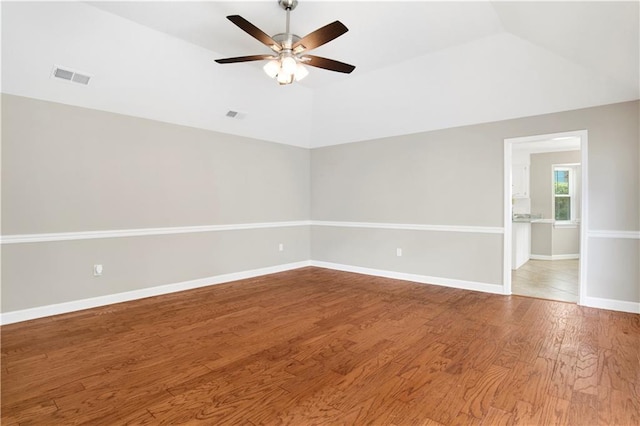 1115 Newbury Ln W, Mobile, AL 36695 - empty room featuring a ceiling fan, lofted ceiling, and wood finished floors