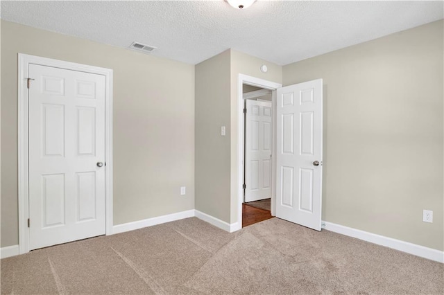 1115 Newbury Ln W, Mobile, AL 36695 - unfurnished bedroom with carpet floors and a textured ceiling