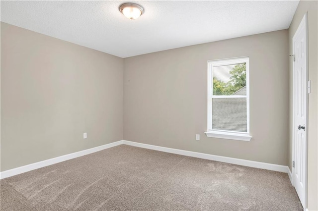 1115 Newbury Ln W, Mobile, AL 36695 - carpeted spare room featuring baseboards and a textured ceiling