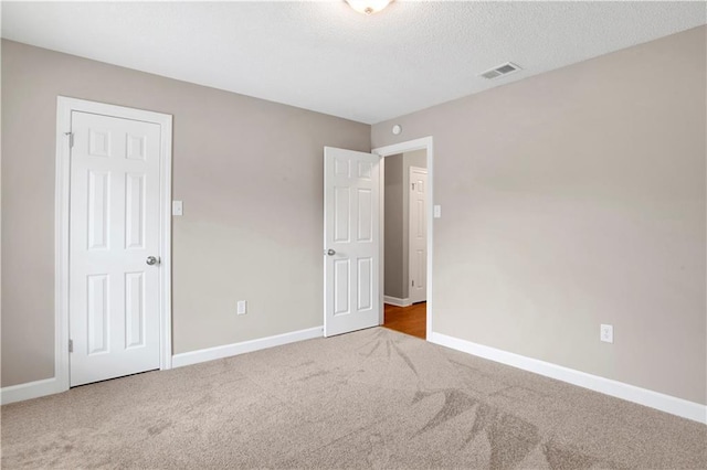 1115 Newbury Ln W, Mobile, AL 36695 - unfurnished bedroom with carpet flooring and a textured ceiling