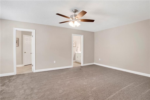 1115 Newbury Ln W, Mobile, AL 36695 - unfurnished bedroom with carpet flooring, connected bathroom, a textured ceiling, and a ceiling fan