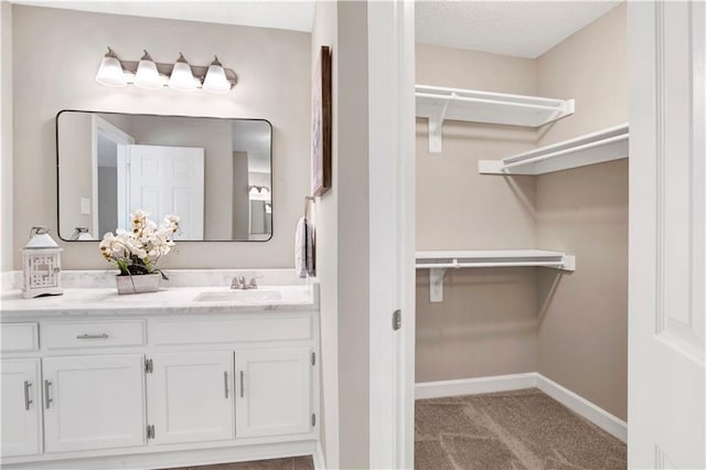 1115 Newbury Ln W, Mobile, AL 36695 - bathroom featuring vanity and a walk in closet