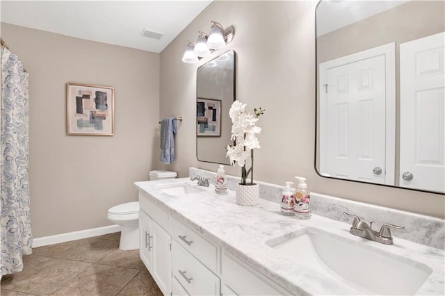 1115 Newbury Ln W, Mobile, AL 36695 - bathroom featuring double vanity and tile patterned floors