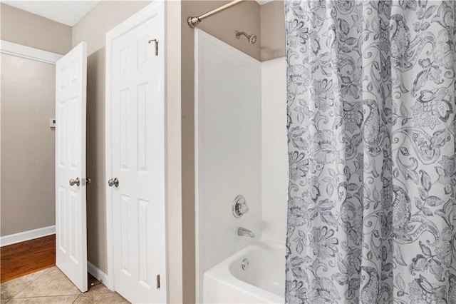 1115 Newbury Ln W, Mobile, AL 36695 - bathroom with shower / bathtub combination with curtain and tile patterned flooring