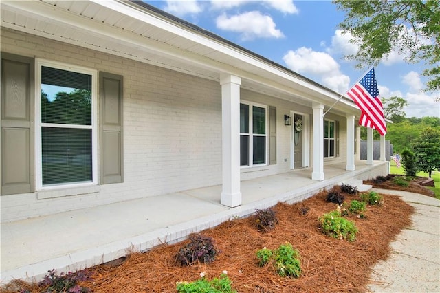 1115 Newbury Ln W, Mobile, AL 36695 - view of property exterior with covered porch and brick siding