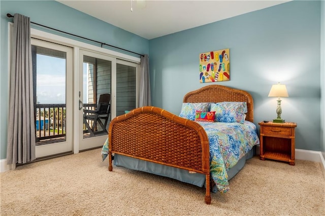 carpeted bedroom with baseboards, ceiling fan, and access to exterior