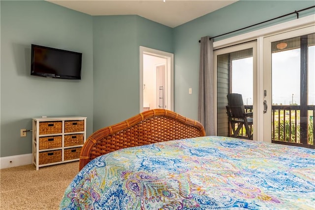 carpeted bedroom featuring access to outside and baseboards