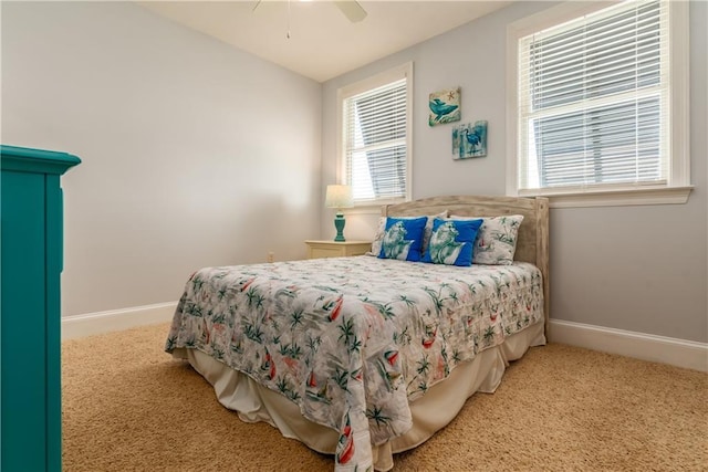 carpeted bedroom featuring ceiling fan and baseboards