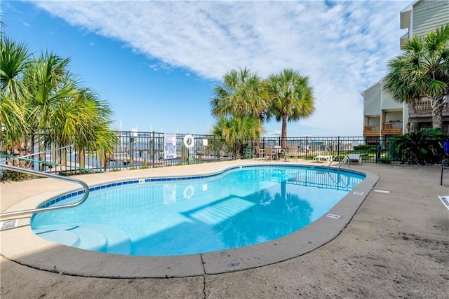 community pool featuring fence