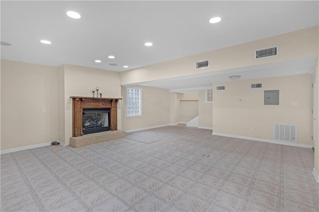 unfurnished living room with electric panel