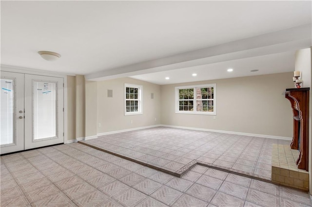 424 Byron Ave E, Mobile, AL 36609 - unfurnished living room featuring baseboards, recessed lighting, french doors, and light carpet
