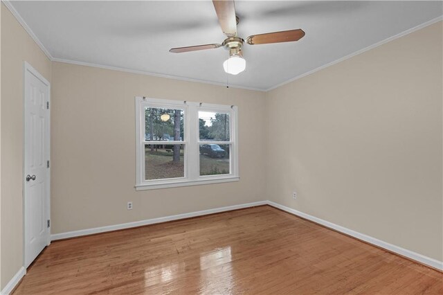 424 Byron Ave E, Mobile, AL 36609 - spare room featuring wood finished floors, ornamental molding, a ceiling fan, and baseboards