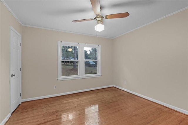 empty room featuring light hardwood / wood-style floors, ceiling fan, and crown molding