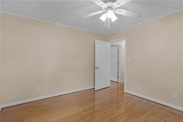 unfurnished room featuring ornamental molding, light hardwood / wood-style floors, and ceiling fan