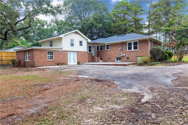 424 Byron Ave E, Mobile, AL 36609 - back of house featuring brick siding, fence, and driveway